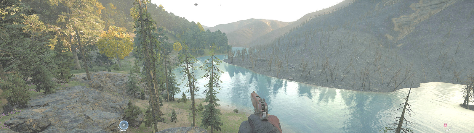 First person holding a handgun looking out over a river