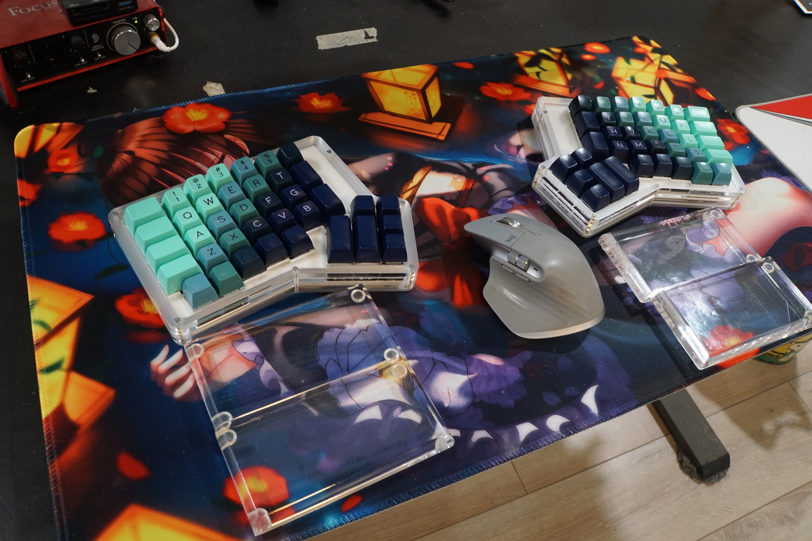 W-Ergo Keyboard fully assembled with keycaps, wrist rests and mouse on a deskmat