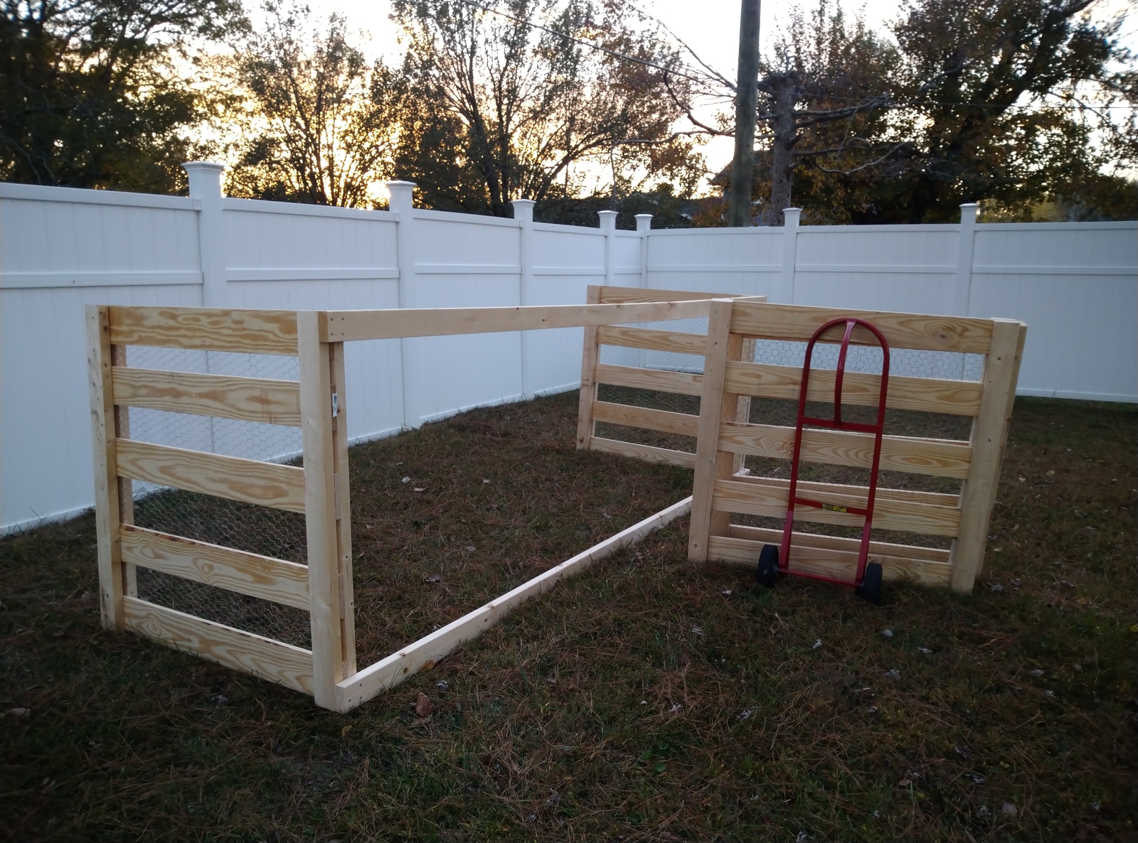 Walls with 2x4x12 holding them up and dividers on a hand truck