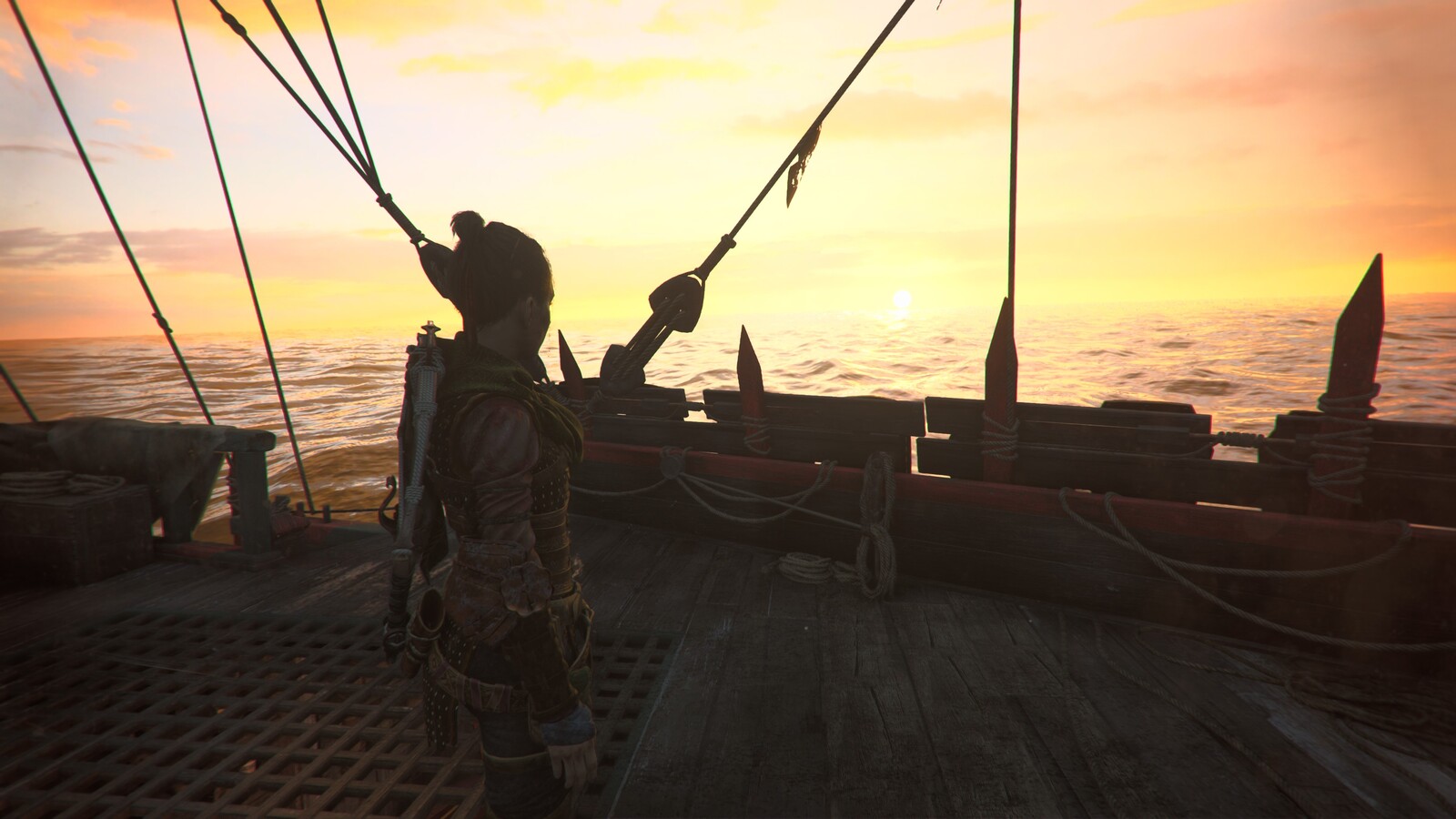 Amicia on a bridge of a ship looking into the sunset