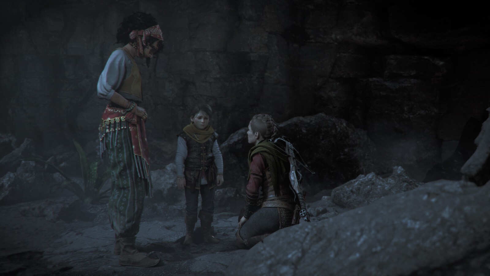 Three characters outside a cave