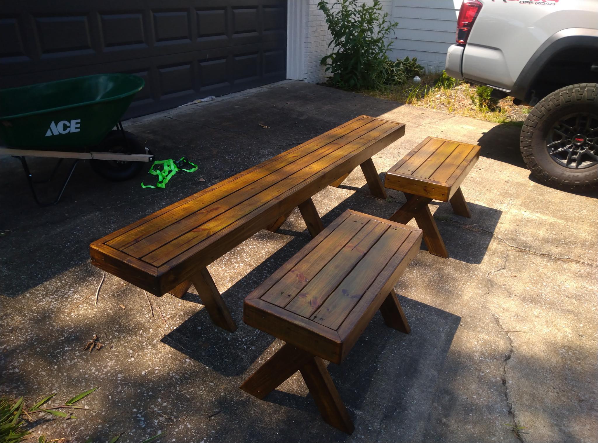 Three of the Finished Wooden Benches on a Concrete Driveway Beside My Truck