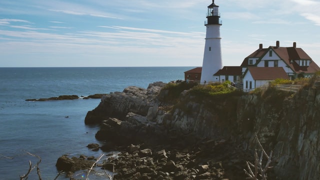 Lighthouse on a cliff above the ocean