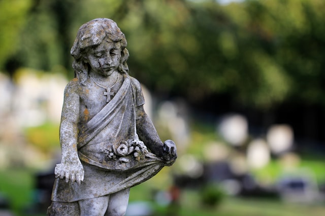Weathered Statue in Graveyard by Sandy Millar