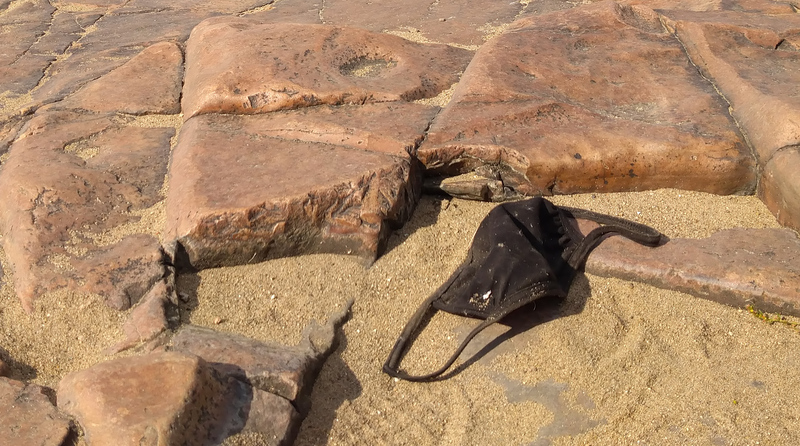 Discarded Mask on the Ground of a Park