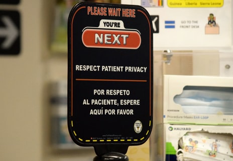 Sign with the words: Please Wait Here. You're Next. Respect Patient Privacy